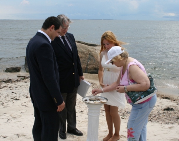 A shell ceremony during a seaside wedding in Harkness Park, CT.