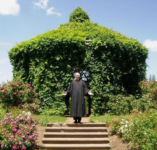 Ernest Adams in a robe at the Elizabeth Park Rose Garden gazebo.