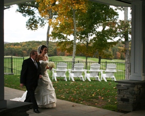 A beautifil bride escorted at her October wedding at Fox Hopyard